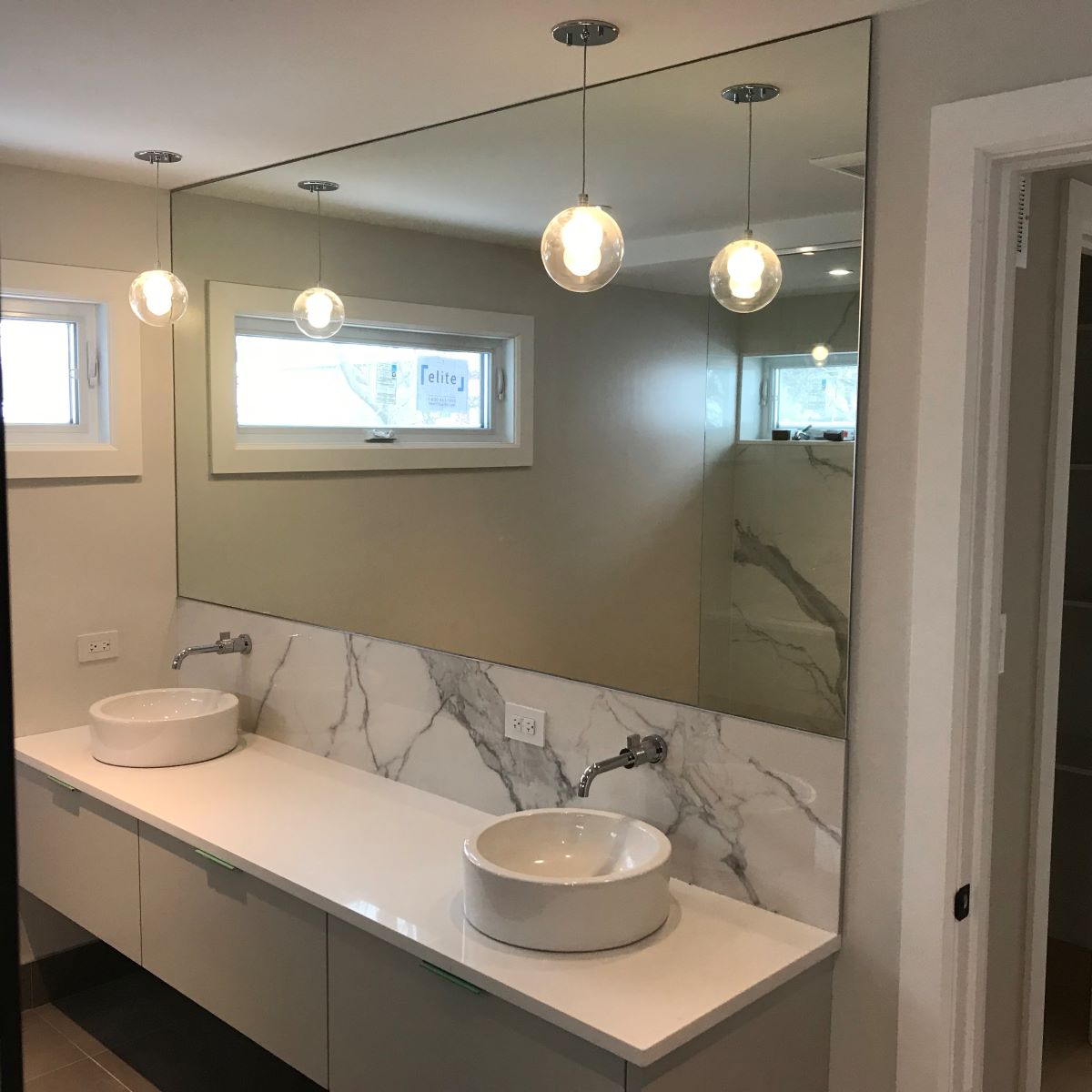 custom glass mirror all the way to the ceiling