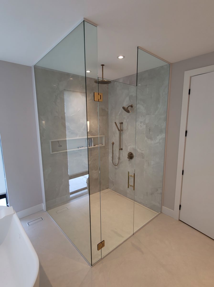 custom glass shower floor to ceiling with a ladder pull handle