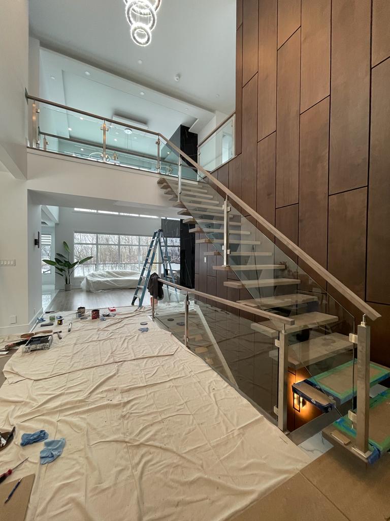 custom glass railing with brush nickle post and wood hand rail