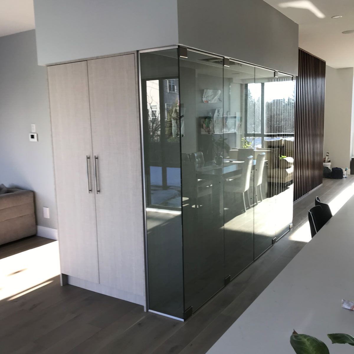 four door glass wine cellar with brushed nickle hardware 