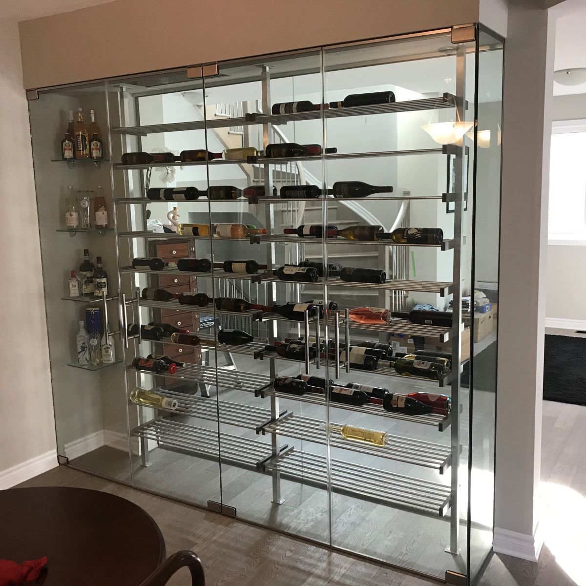 4 door glass wine cellar with brushed nickel pivot hardware