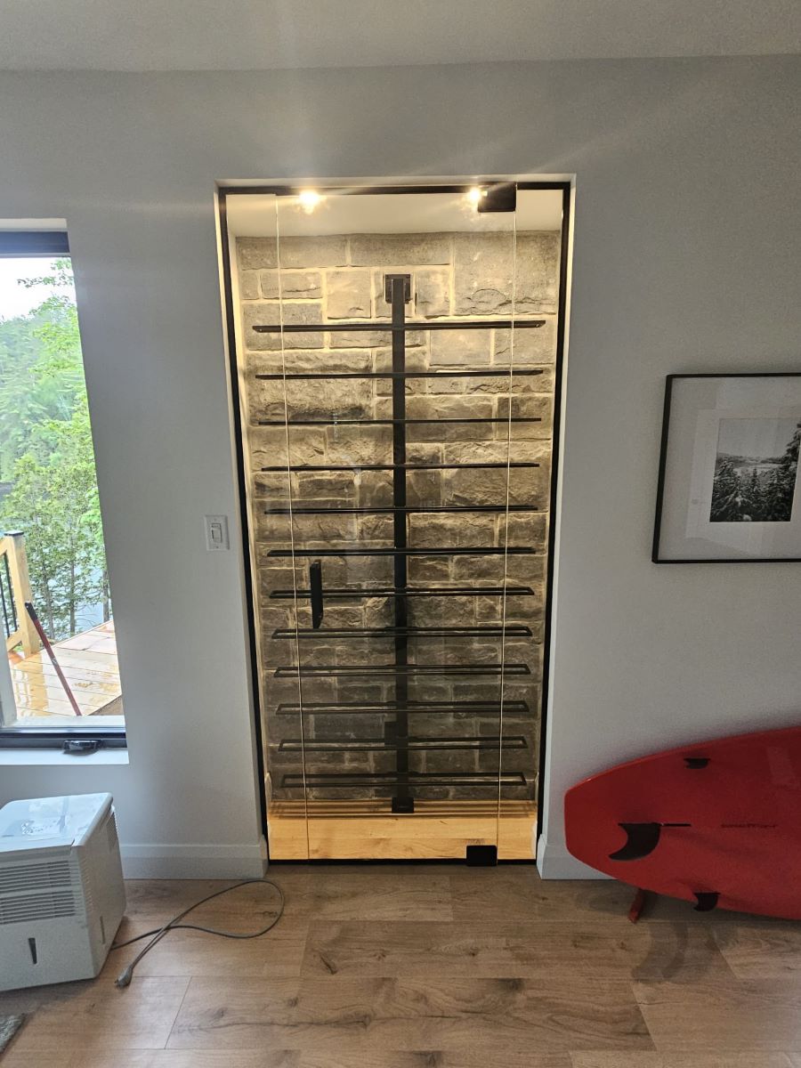 one door glass wine cellar with matte black hardware and a square handle 