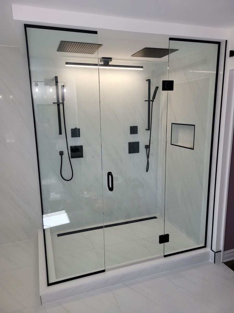 custom glass shower with floor to ceiling glass and all matte black hardware 