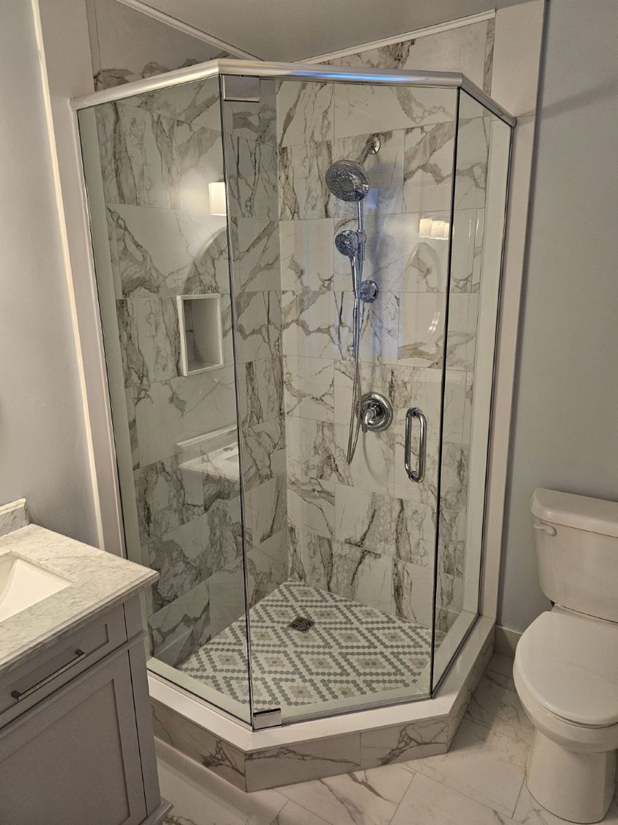 custom glass neo angle shower with chrome hardware 