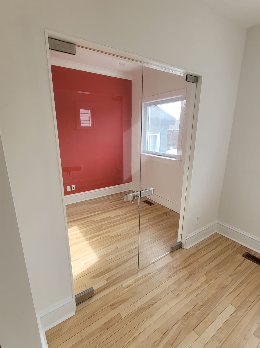 double pivot doors with a lock and brushed nickle hardware 